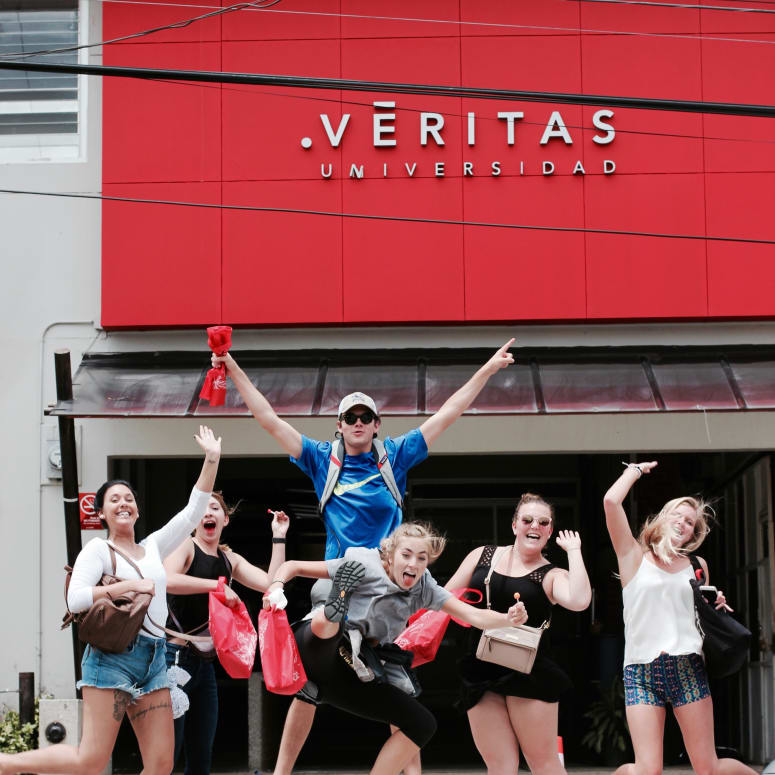 A group of students in front of an Universidad Veritas building in Costa Rica.